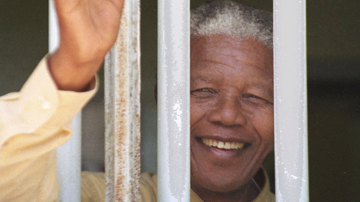 Nelson Mandela, visiting the prison cell he occupied on Robben Island for much of his 27-year incarceration
(Source: NPR)