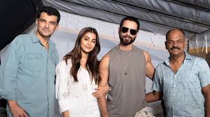 Shahid Kapoor and Pooja Hegde on the set of their upcoming movie Deva, posing with crew member