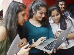 Group of students checking NEET UG result on a laptop