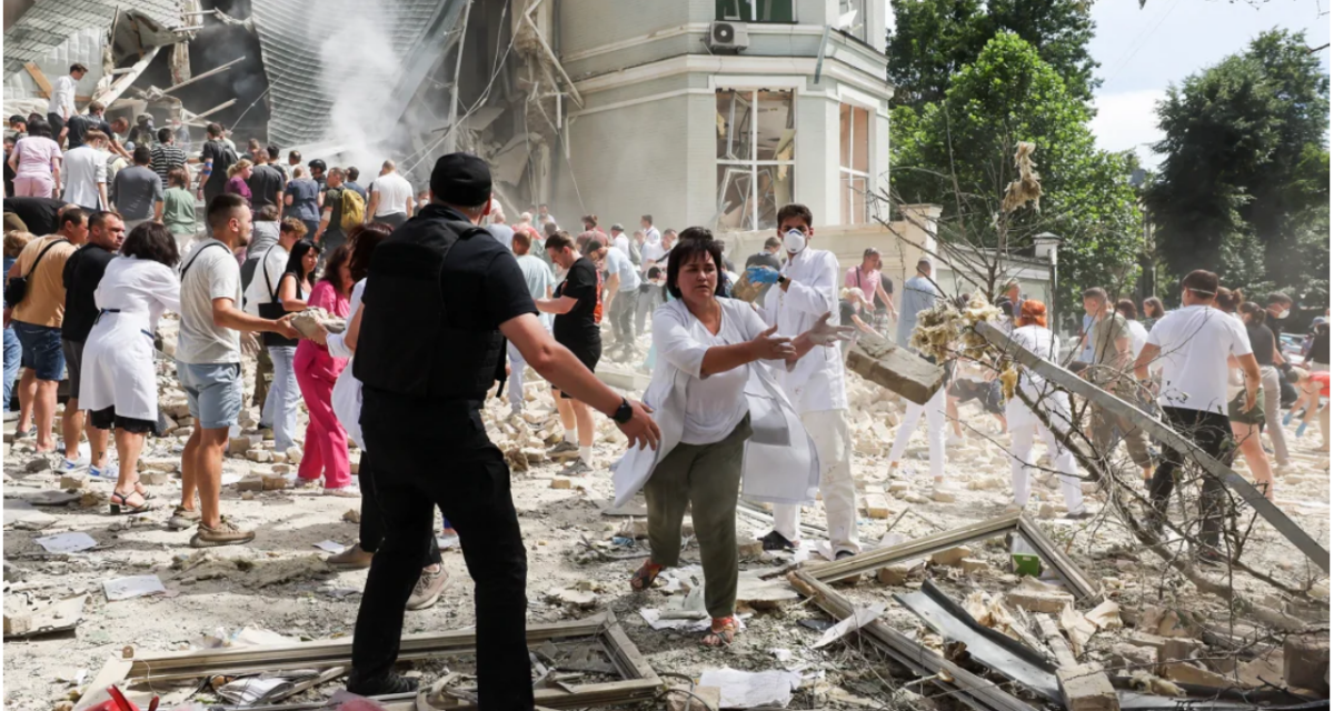 Doctors and other civilians engaged in clearing the rubble after the attack by Russia