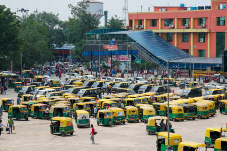 Taxis and auto rickshaws stand parked outside New Delhi Railway Station