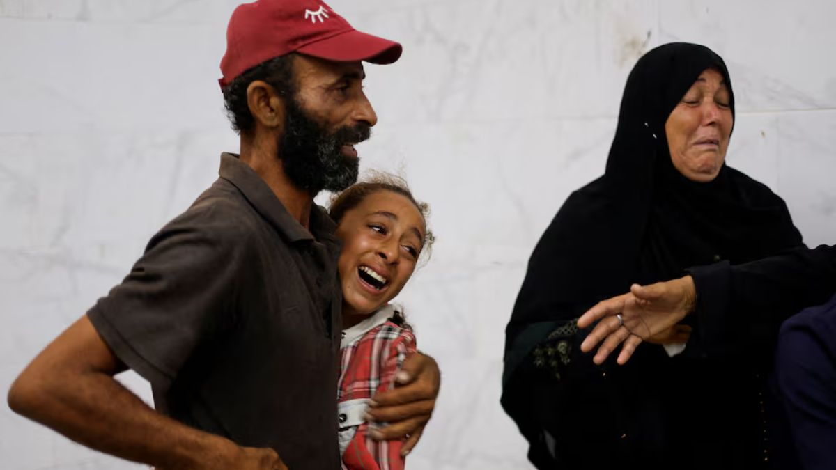 Mourners grieve for the loss of their loved ones as Israel continues to pound Gaza