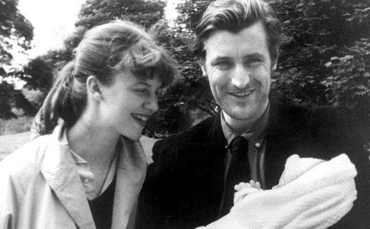 A photograph of Sylvia Plath and Ted Hughes with their child
