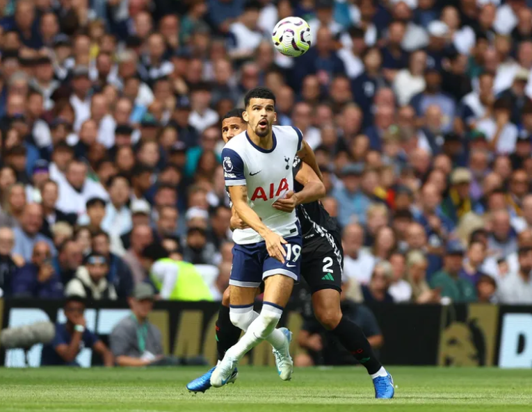 Tottenham's Dominic Solanke battling with Arsenal's William Saliba for possession.