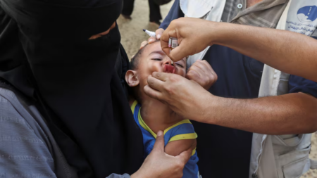 A Palestinian child is vaccinated against polio, amid the Israel-Hamas conflict, in Deir Al-Balah in the central Gaza Strip, September 4, 2024.