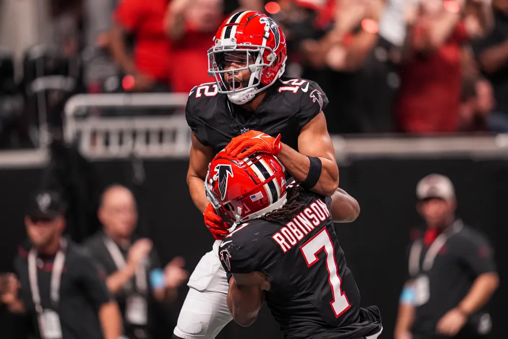 Atlanta Falcons wide receiver KhaDarel Hodge (12) reacts with running back Bijan Robinson (7) after scoring the game winning touchdown against the Tampa Bay Buccaneers in overtime at Mercedes-Benz Stadium in the NFL.