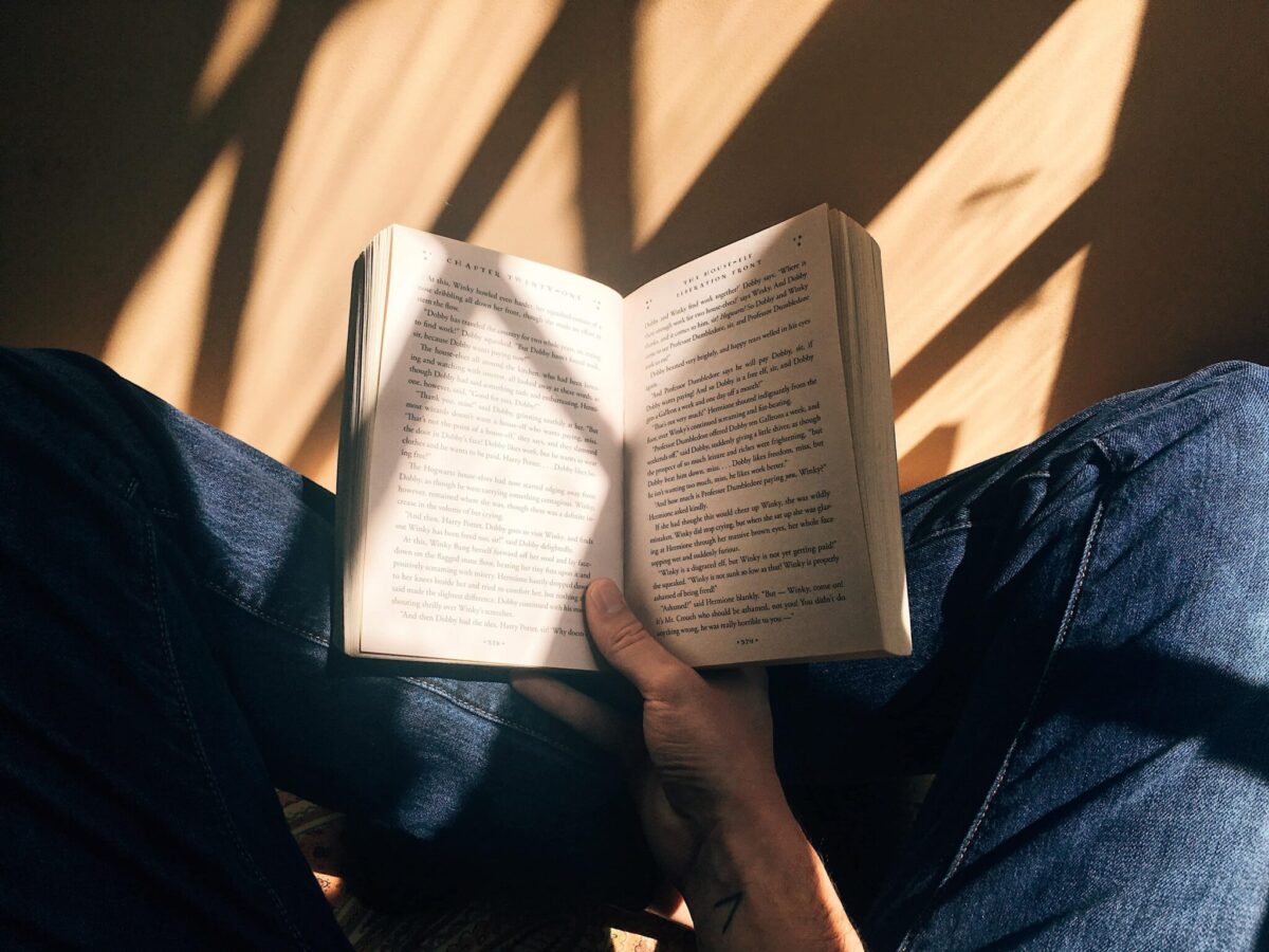 Girl holding a book in her lap