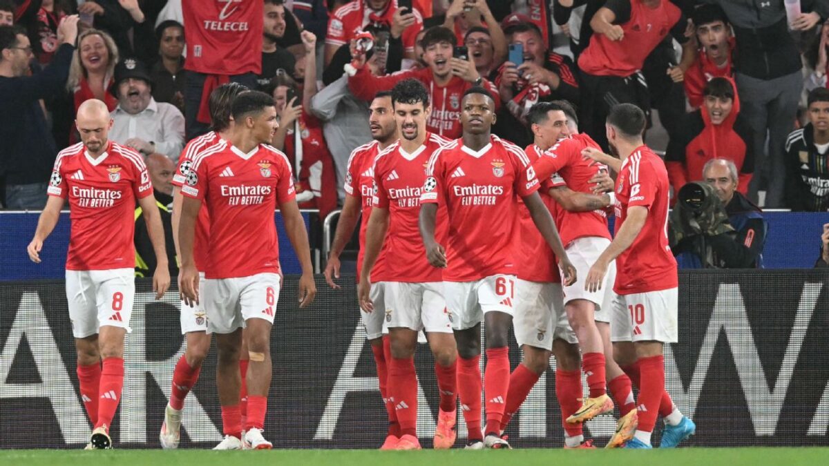 Benfica players celebrate after scoring a goal against Atletico Madrid in the UCL 2024-25.