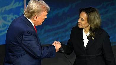 US Presidential candidates Kamala Harris and Trump shaking their hands during election campaigns. 