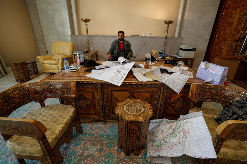 Syrian opposition fighter at Assad's Palace.