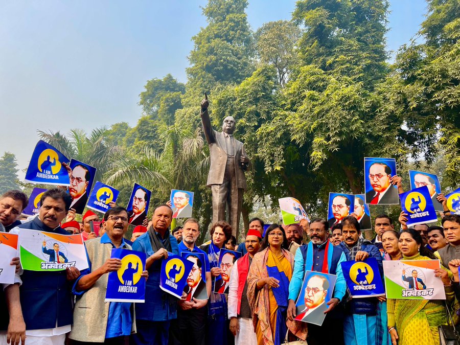 protests outside parliament over Amit Shah's remarks on Ambedkar.