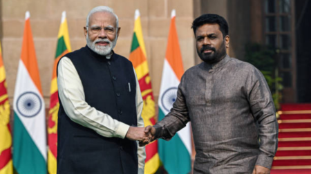 Indian PM Narendra Modi and Sri Lankan President Dassanayake shaking hands.