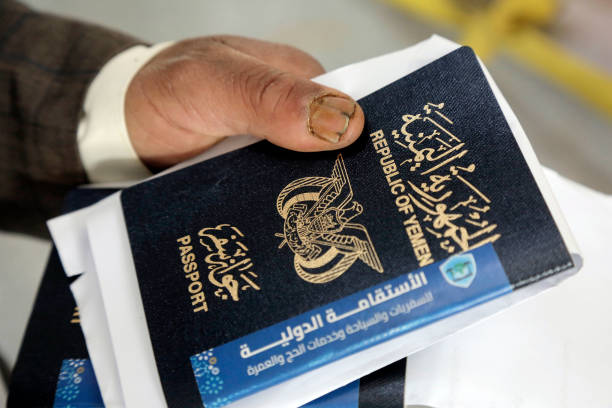 A Yemeni pilgrim holds his passport at the International Sana'a Airport to fly to Saudi Arabia for the annual Hajj pilgrimage on May 28, 2024, in Sana'a, Yemen. The first Hajj flight of 437 pilgrims going to Saudi Arabia on Yemenia Airways departed Sana'a International Airport on Tuesday as part of the total of 12,000 pilgrims who are authorized to go to Saudi Arabia to perform Hajj. 