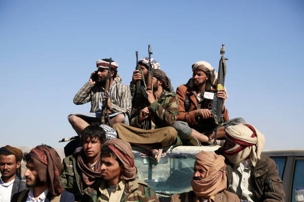 SANA'A, YEMEN - DECEMBER 23: Yemen's Houthi loyal fighters participate in an armed-tribal gathering against Israel and its main allies the US and UK on December 23, 2024, in the suburb of Sana'a, Yemen. Following almost a year of Yemen's Houthi attacks on Israeli territories and ships linked to it and its main allies' the US and UK, momentarily after the birth of the Israeli war on Gaza in October 2023, in an action Houthi considered in solidarity with Palestinians, Prime Minister Benjamin Netanyahu vowed to take powerful military action against the Houthi group in Yemen. 