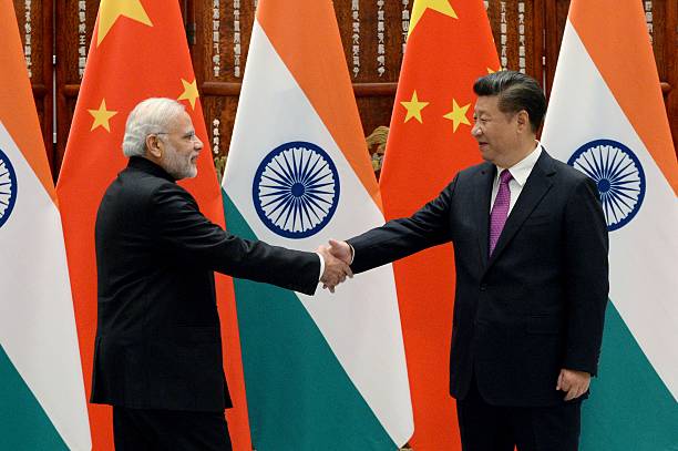 HANGZHOU, CHINA - SEPTEMBER 4: Indian Prime Minister Narendra Modi (L) shakes hands with Chinese President Xi Jinping (R) at the West Lake State Guest House on September 4, 2016 in Hangzhou, China. The 11th G20 Leaders Summit will be held from September 4-5.