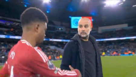 Pep shaking hands with Amad